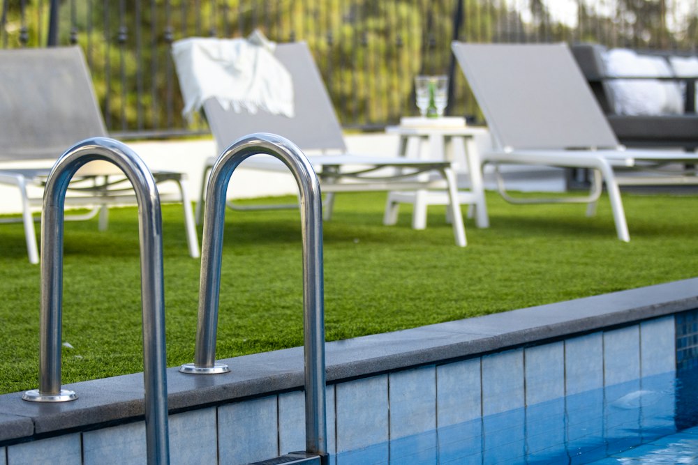 Artificial turf lawn beside a pool deck